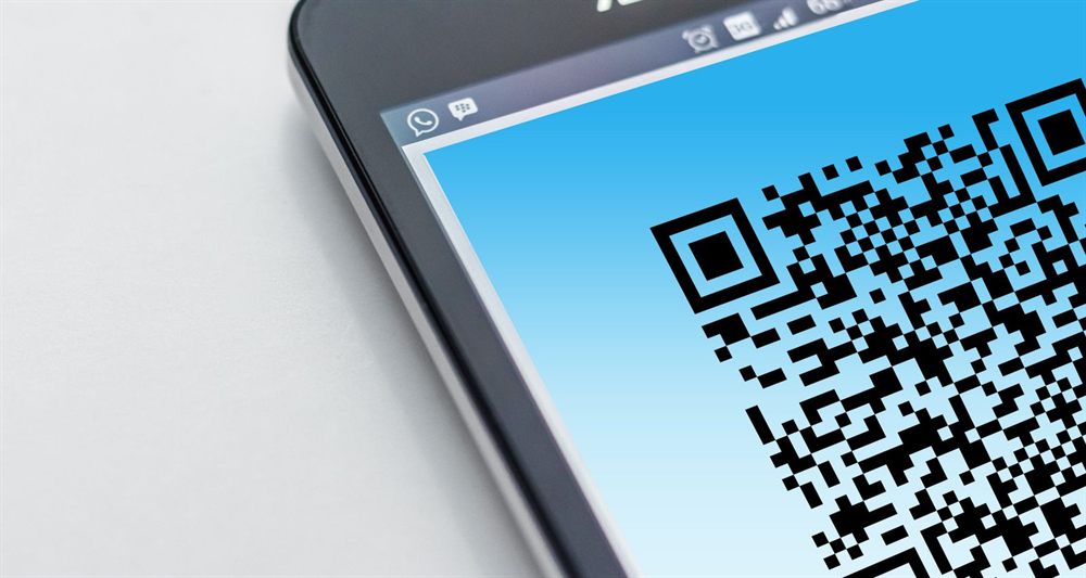 Close-up of a phone screen showing a QR code